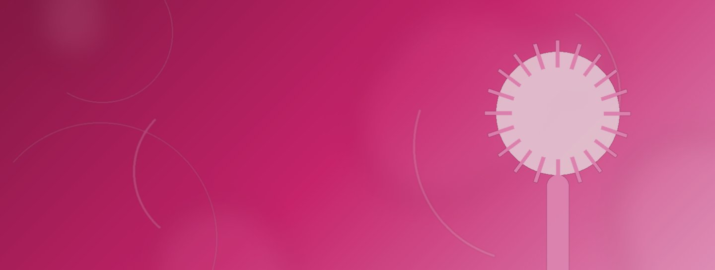 Warmluftbürste vor rosé-farbenem Hintergrund